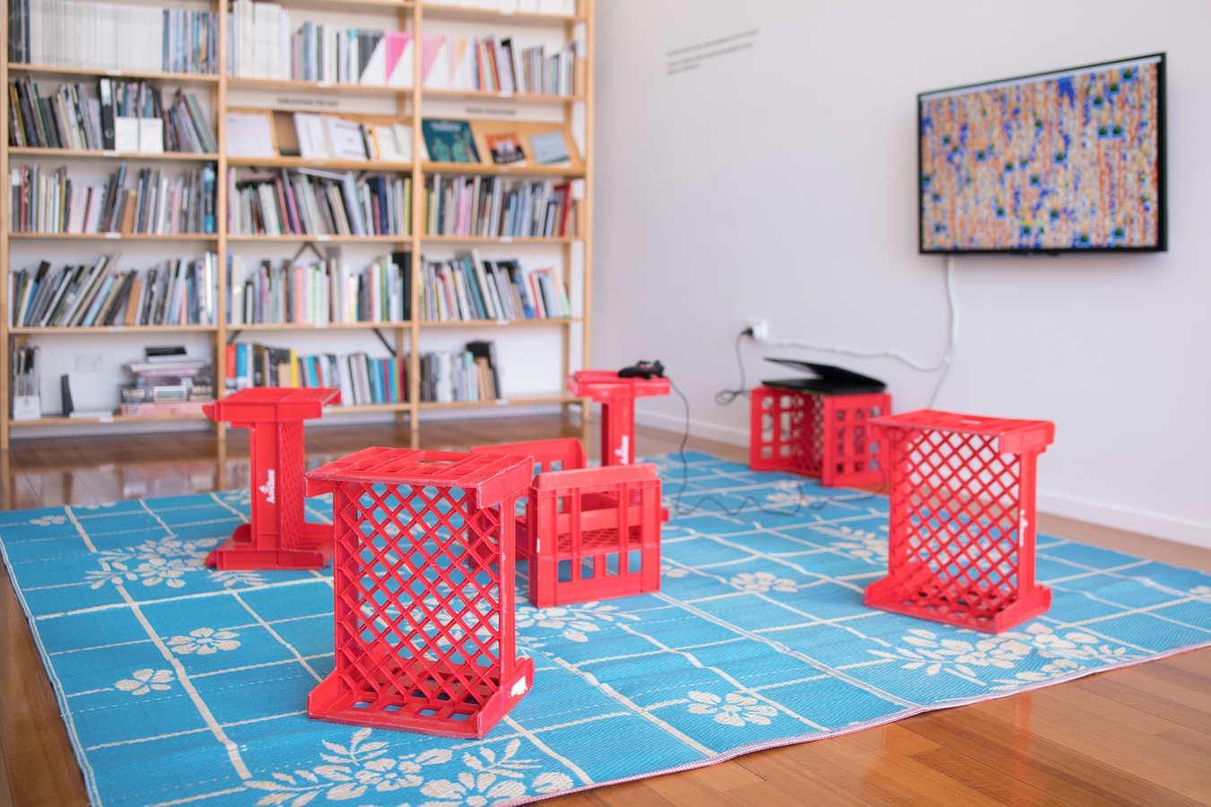 Image: Kahurangiariki Smith, FOB (installation view), 2016, video game, TV, controller, milk crates, mat. Interactive installation. Photo: Janneth Gil.