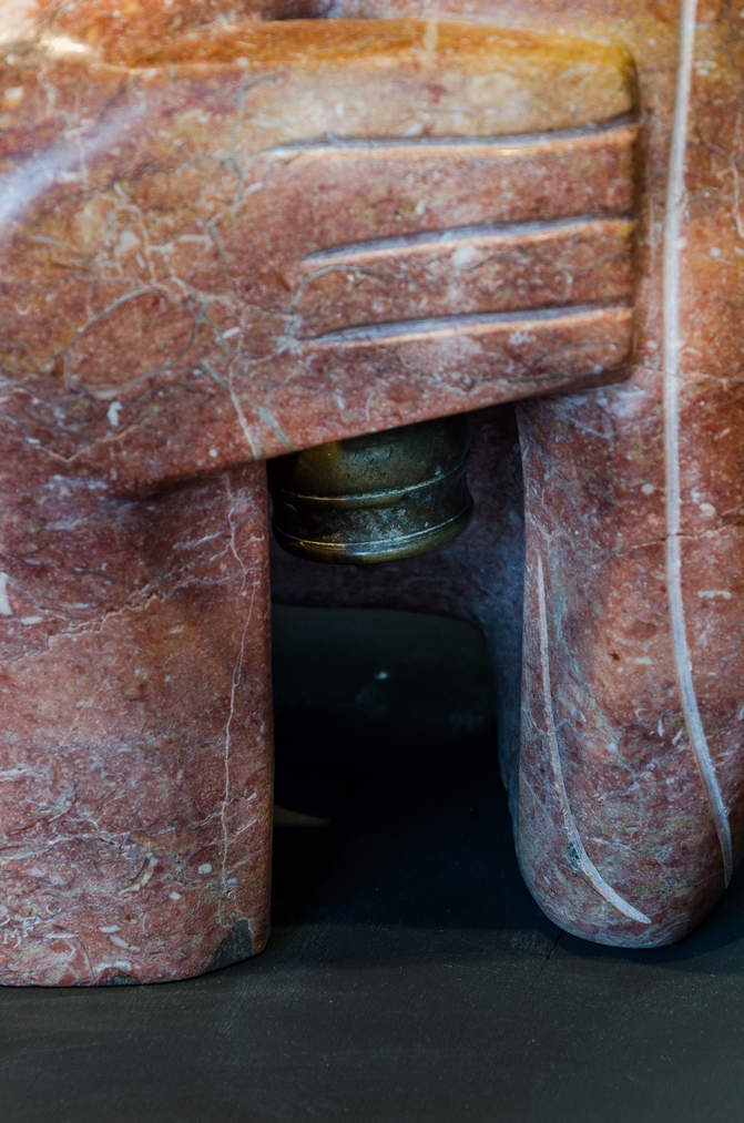 Pat Foster, Pink Kiss (detail), 1997, Hanmer pink marble with brass bell, collection of the Aigantighe Art Gallery, Timaru. Image: Mitchell Bright.